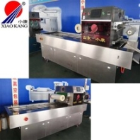 盐焗鸡全自动连续封盒真空包装机-盒式气调卤煮包装机